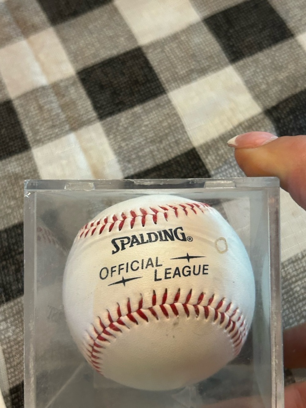Spalding Official League baseball featuring red stitched seams.